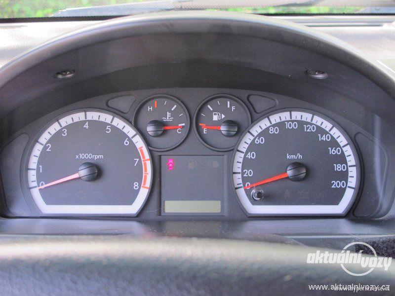 Chevrolet Aveo 1.2, benzín, RV 2011, el. okna, STK, centrál, klima - foto 11