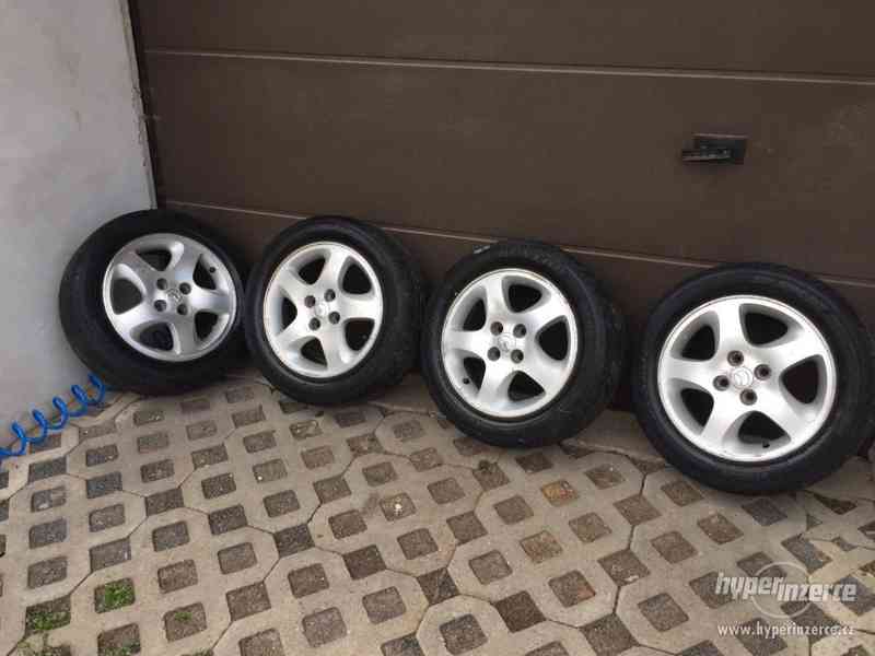 Alu 15" Mazda,Ford 4x100 s Pneu