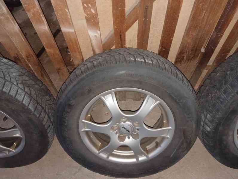 Zimní kola s diskama 215/70 R16 - foto 4