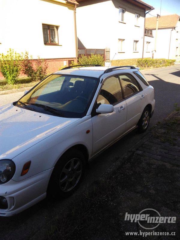 Subaru Impreza 2.0 - foto 4