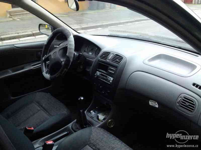 Mazda 323F 1,5 65 kw, LPG - foto 6