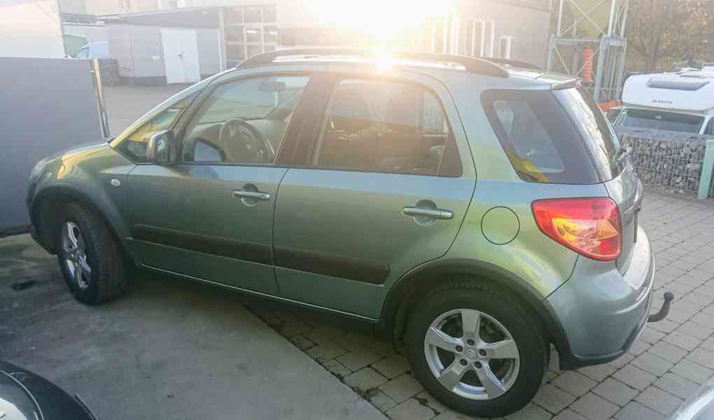 Suzuki SX4 1,6i 4x4 benzín 88kw - foto 9