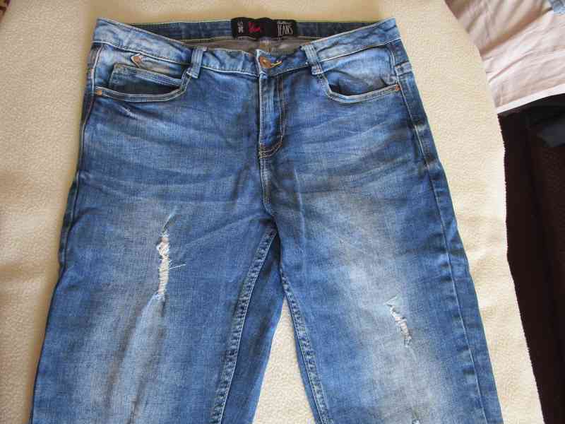 Pěkné modré elast. rifle Slim - trhané, vel. S (36) - foto 3