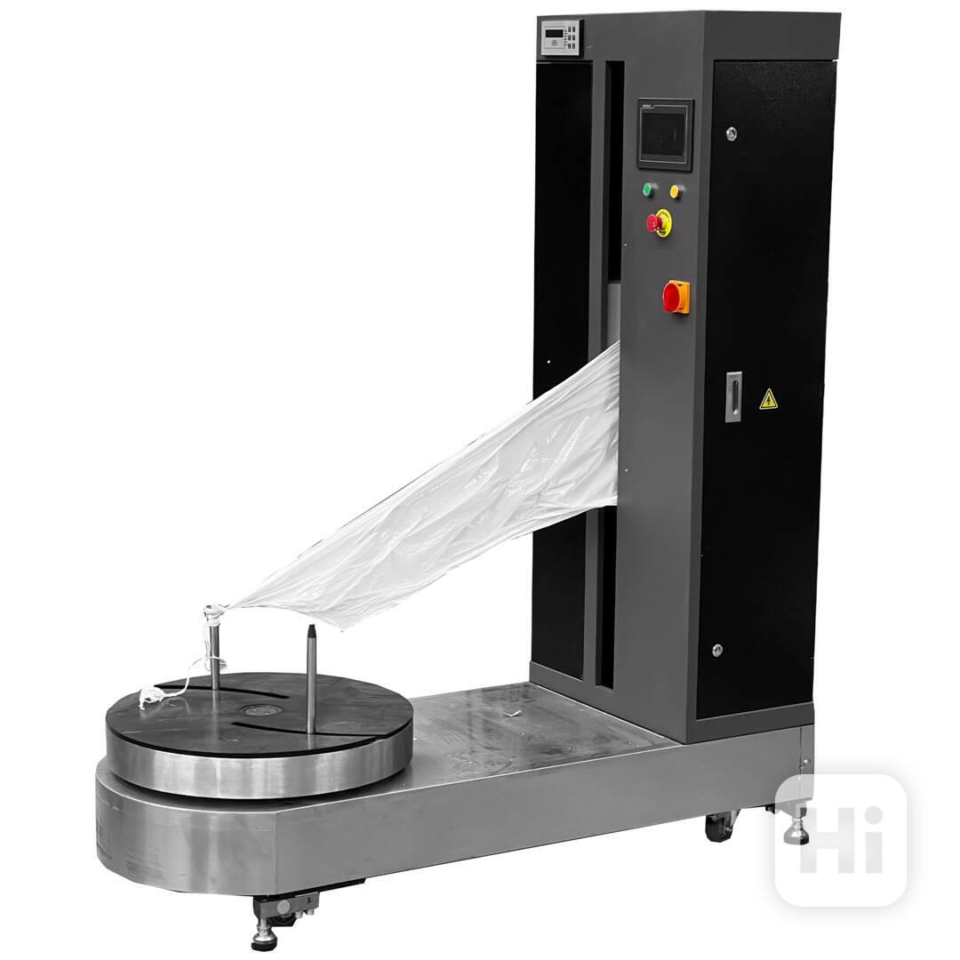 Stroj na balení balíků a kufrů - foto 1