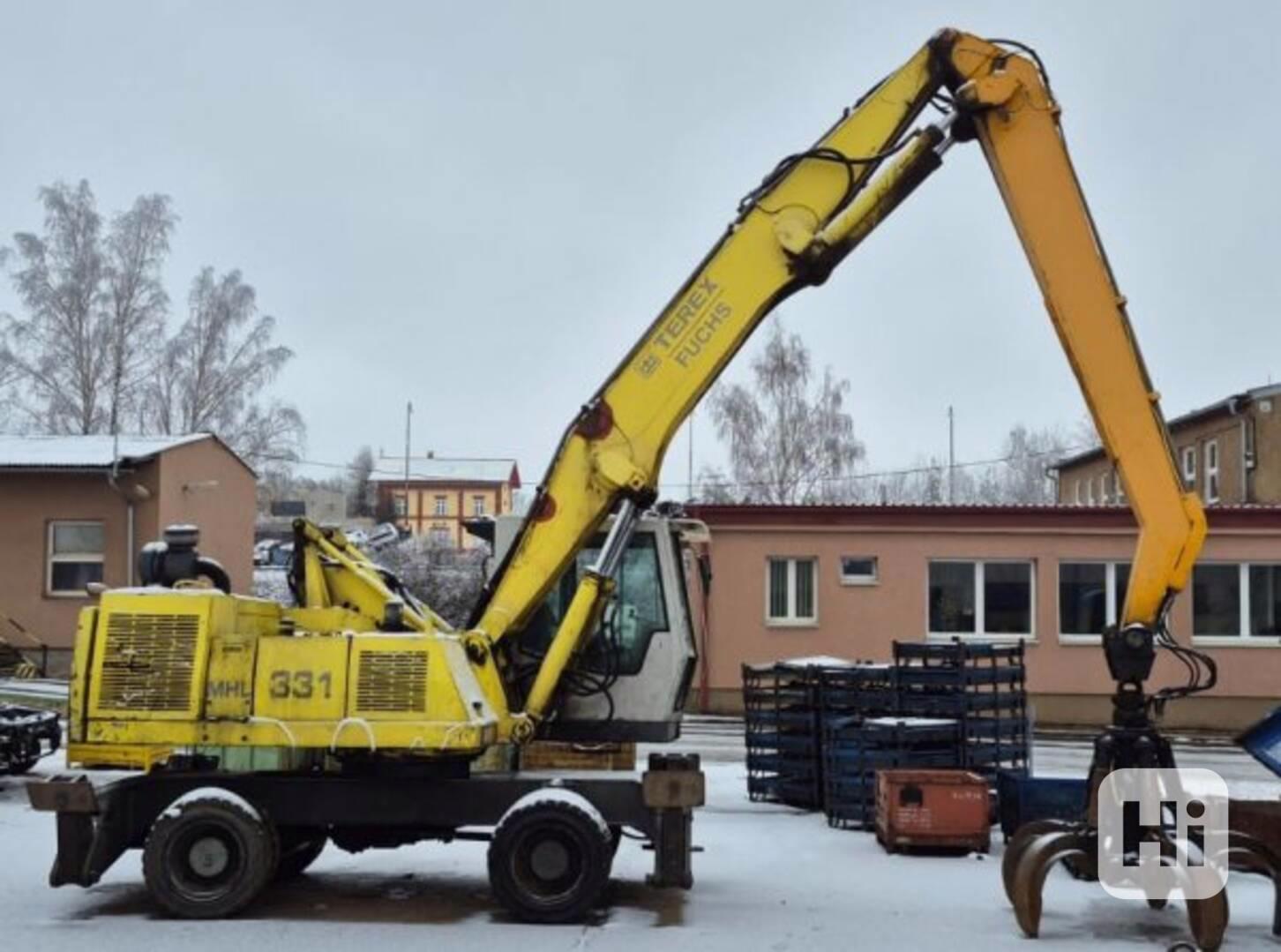 22.5t překládací bagr Fuchs 331 kovošrot kolové rypadlo - foto 1