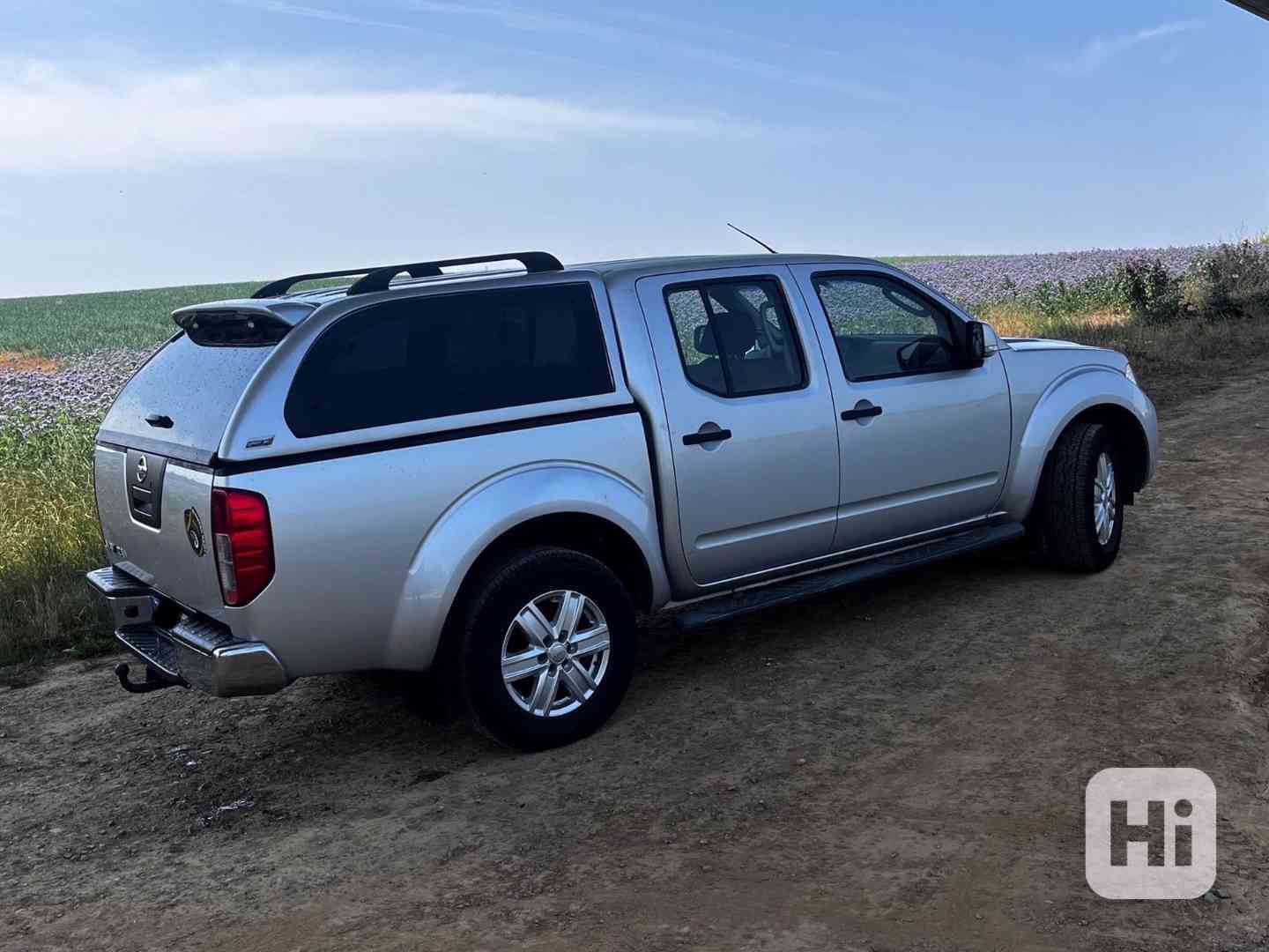 Nissan Navara 2,5DCi  King Cab XE 140kw - foto 1