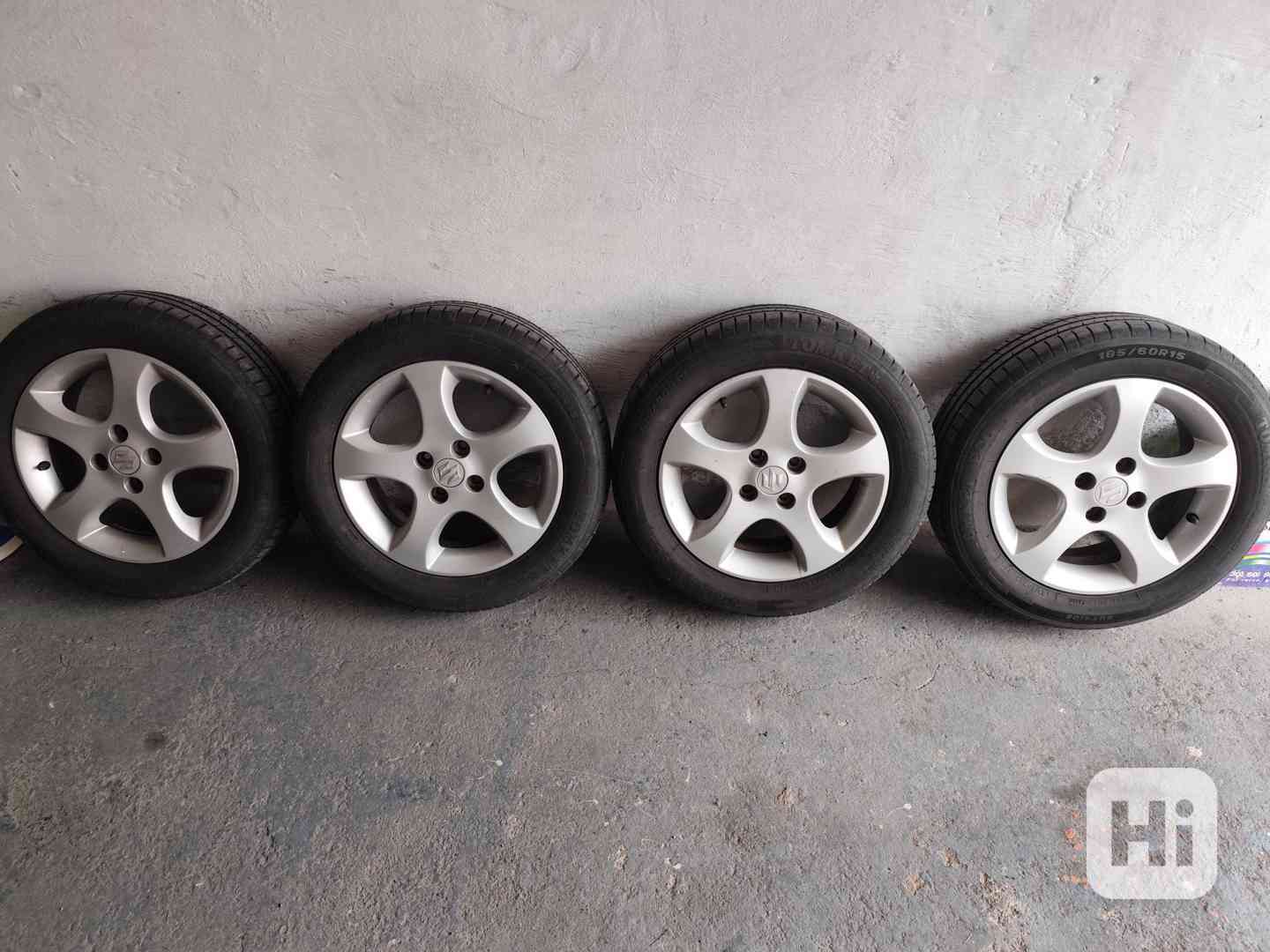 Originální Alu kola Suzuki 15" 4x100 + Letní pneu - foto 1